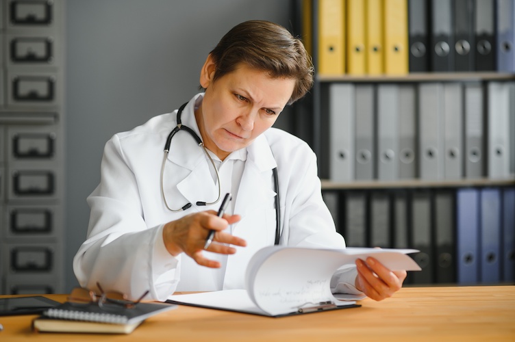 Portrait of senior female doctor in her office